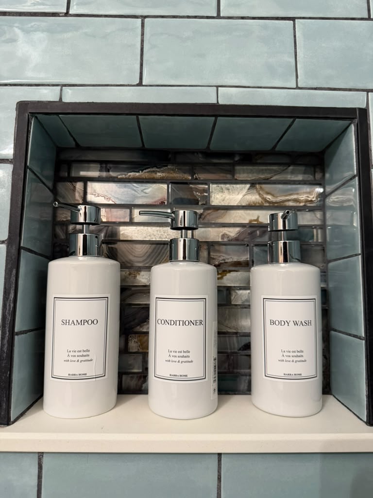 Labeled shampoo, conditioner, and body wash dispensers